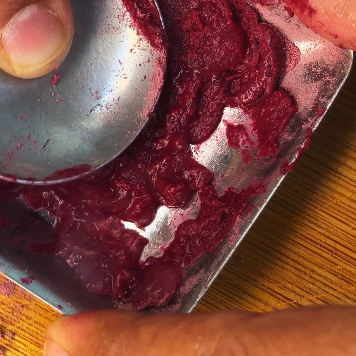 Fresh aloe vera gel mixed with Athreya rose petal powder into a pink jelly on a steel tray